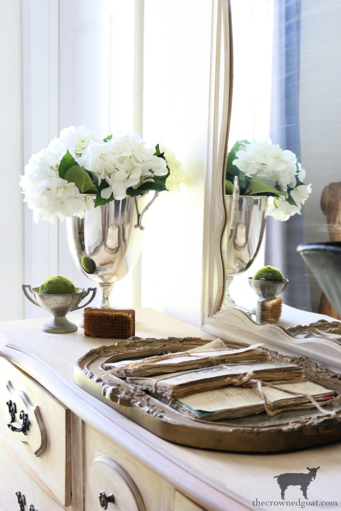Vintage silver trophies and trays, displayed to emphasize their reflective surfaces and classic designs, perfect for adding a touch of elegance to home decor.