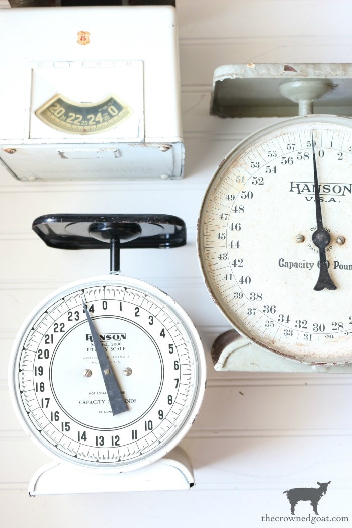 Vintage metal scales, displayed as decorative objects to highlight their industrial charm and versatility in home styling.