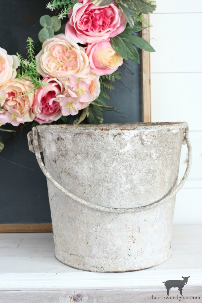 Vintage garden urns and galvanized containers, displayed to showcase their rustic charm and versatility for seasonal decorations.