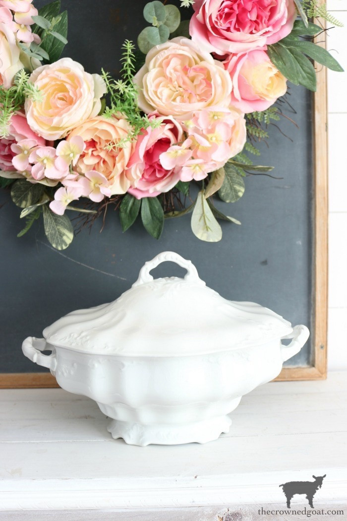 A collection of white ironstone dishes, including tureens and pitchers, displayed to showcase their classic shapes and creamy white color.