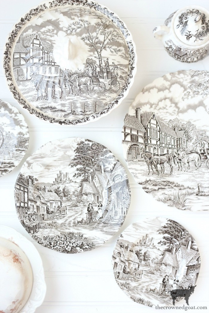 A selection of brown and white transferware dishes, arranged to highlight their detailed patterns and warm, earthy tones.