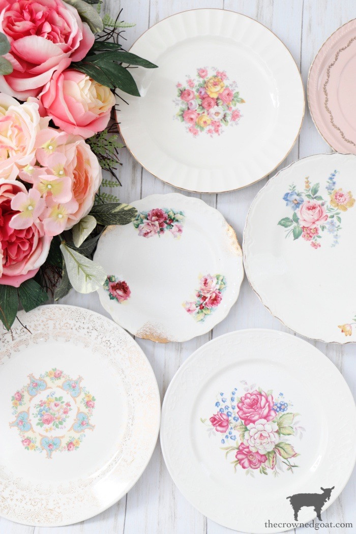 A vibrant display of mixed and matched vintage dishes, showcasing a variety of patterns and colors, emphasizing their eclectic charm and affordability.