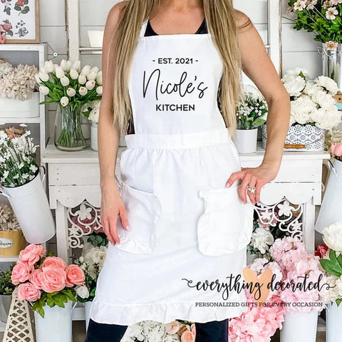 Personalized apron in poly cotton with custom name or design, a practical and stylish birthday gift for wife who loves cooking or baking.