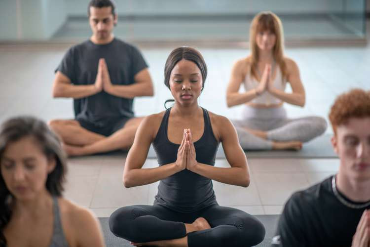 Yoga class membership, a wellness birthday gift idea for wife, promoting physical and mental well-being through yoga practice (via Canva)