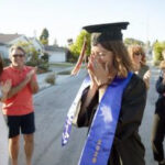Woman celebrating her graduation with friends