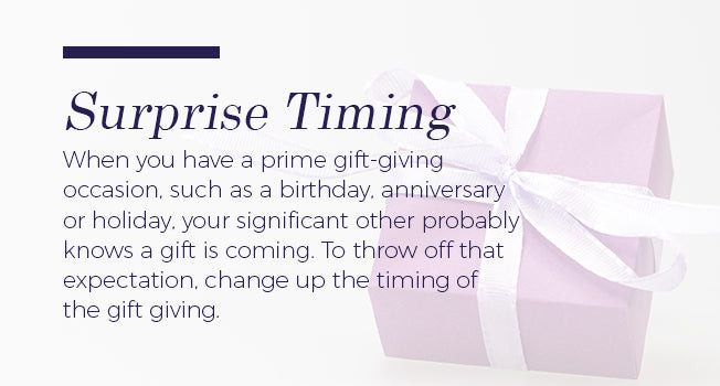 Woman surprised by a jewelry gift received unexpectedly, illustrating the joy of surprise timing