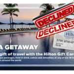 a stack of Hilton gift cards
