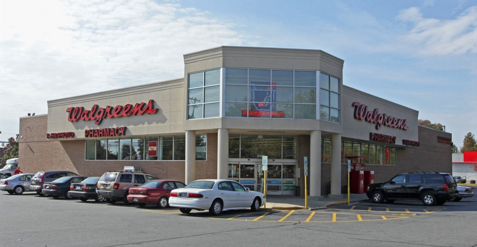 Exterior shot of a Walgreens store with a prominent gift card display